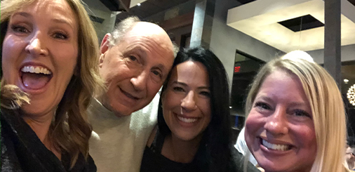Selfie of Doctor Layman with two women and an older man