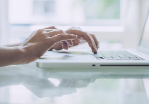 Person typing on laptop