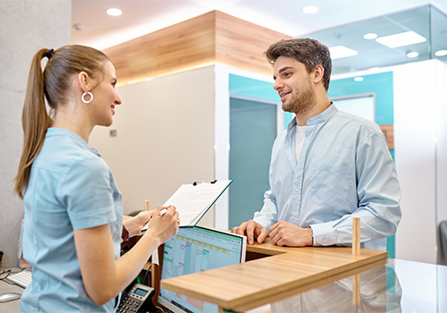 Dental insurance form on dark wooden table