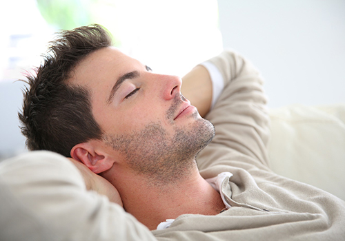 Man sleeping peacefully on sofa