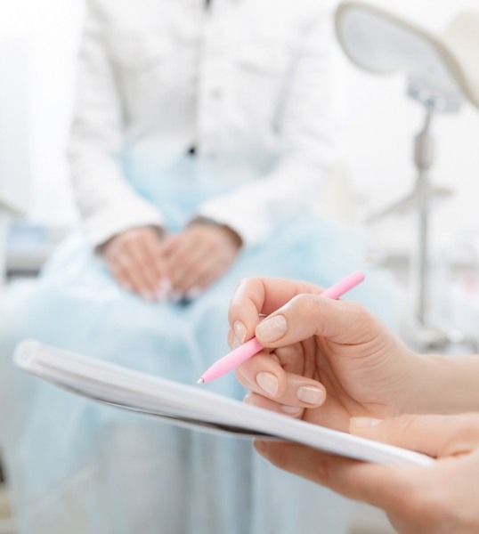 Person typing on tablet with stylus after sleep testing in Mesa