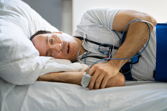 man doing an at-home sleep apnea test 