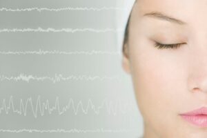 Woman undergoing a sleep study. 