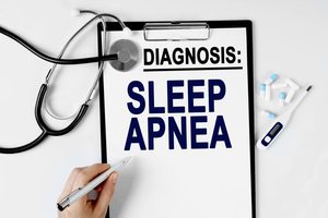 &ldquo;Diagnosis: Sleep Apnea&rdquo; written on clipboard 